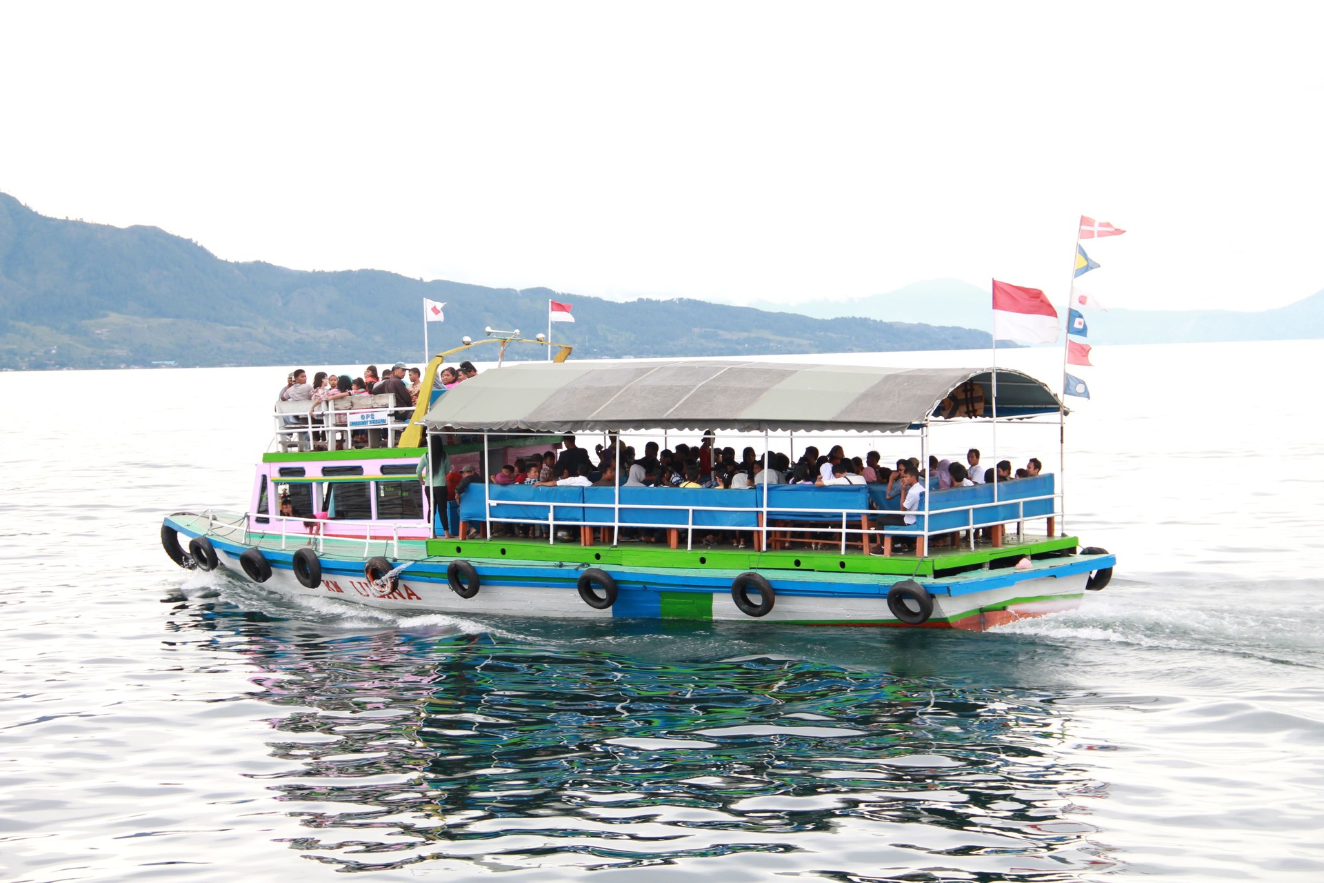 Ferries on Lake Toba. View of Lake Toba from the Highland